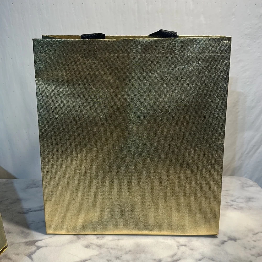 11 Sturdy Reusable Bags with handles in glossy gold.